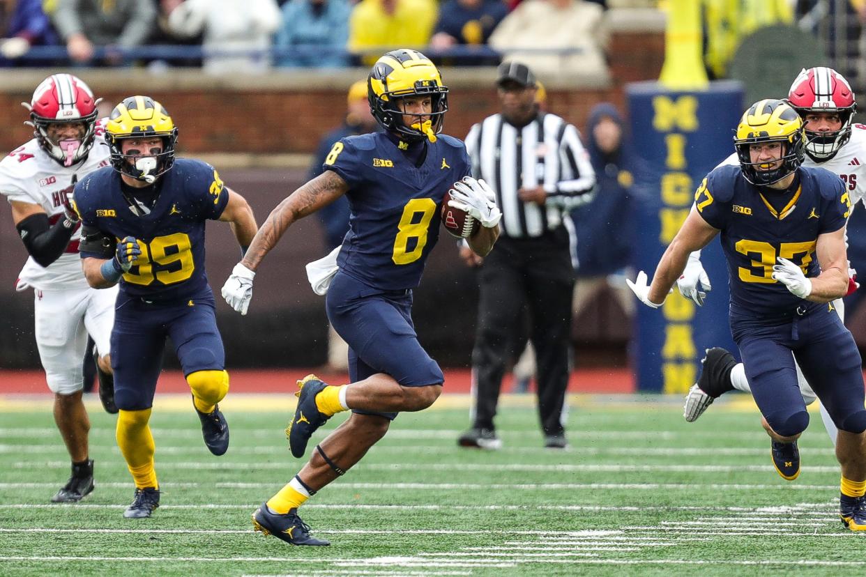 Michigan punt return Tyler Morris (8) runs against Indiana during the first half at Michigan Stadium in Ann Arbor on Saturday, Oct. 14, 2023.