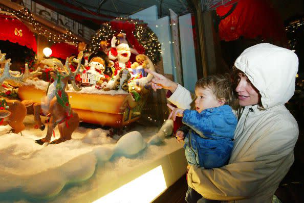 2002 NEW YORK - NOVEMBER 22:  A child looks at a Christmas scene depicted in a Macy's at Herald Square department store window during the unveiling of the retailer's holiday windows November 22, 2002 in New York City.  (Photo by Matthew Peyton/Getty Images)