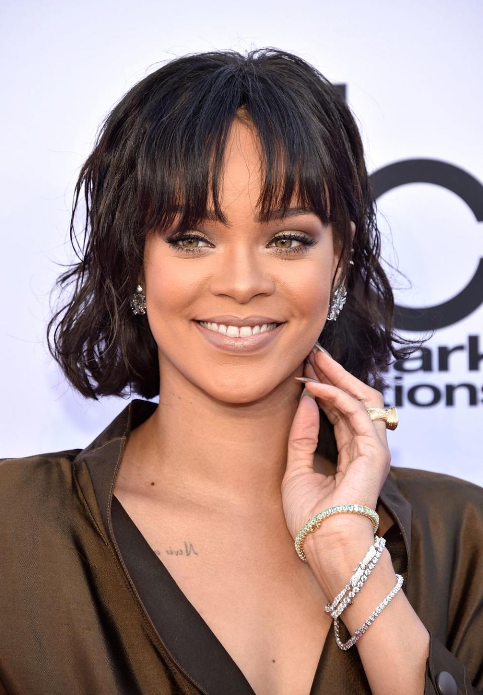 <p>Rihanna is constantly changing her hair – her oval face shape means she suits most hairstyles. This fringe is the thing that stops her new lob from being mumsy. </p>