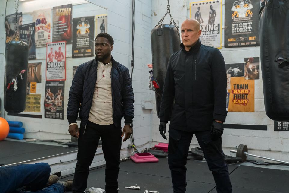 Kevin Hart (left) stars as an unlucky fitness entrepreneur who gets mistaken for a notorious assassin (Woody Harrelson) in the Netflix action comedy "The Man From Toronto."