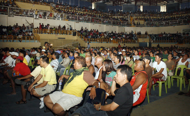 People Watch The Live Telecast Of The WBO Welterweight Title Bout Between Philippine Boxing Icon Manny Pacquiao And  AFP/Getty Images