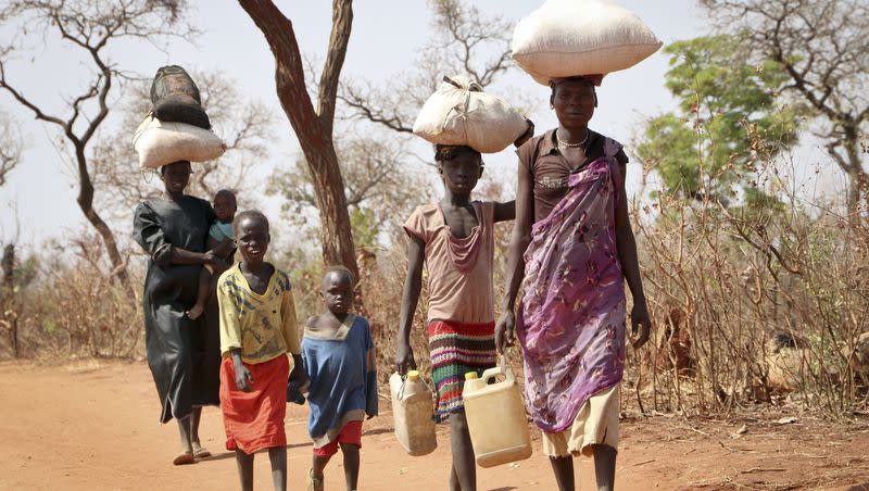 After walking for days, a refugee family arrives in Yida, South Sudan, in 2018. South Sudan’s president on Feb. 22, 2023, urged the country’s more than 2 million refugees to return home in his first meeting with displaced people since civil war erupted almost a decade ago.