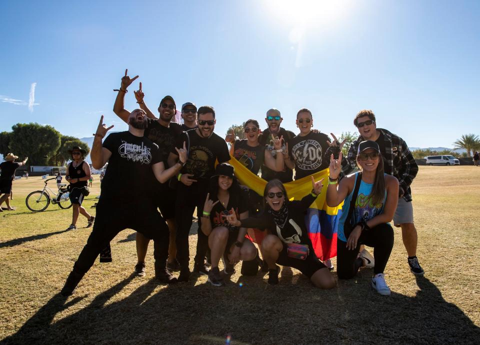 A group of friends who traveled from Columbia pose for a photo together on their way into the Power Trip Music Festival at the Empire Polo Club in Indio, Calif., Saturday, Oct. 7, 2023.