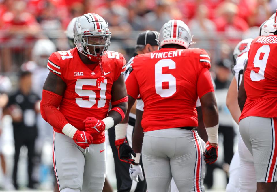 Ohio State defensive tackle Michael Hall Jr. (51) celebrates a first-quarter tackle for loss against Arkansas State, Sept. 10, 2022, in Columbus.