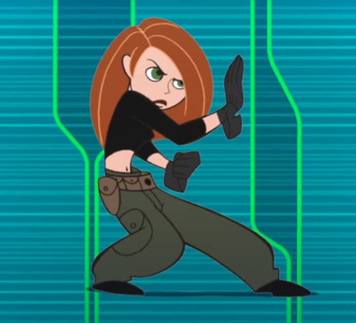 Kim Possible strikes a pose as she prepares to fight villains