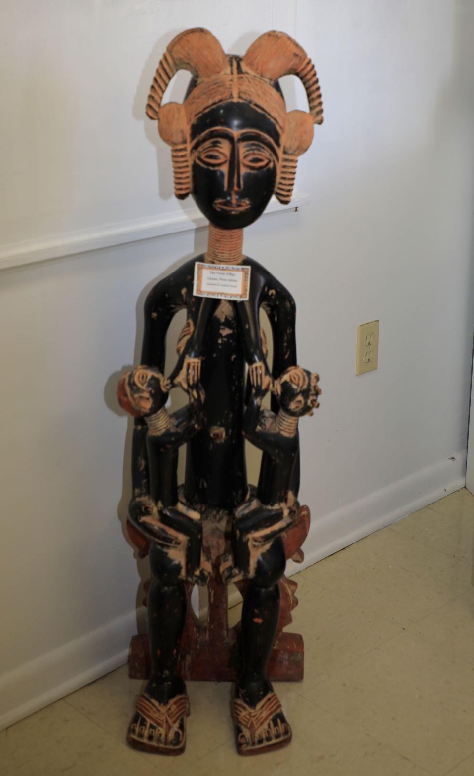 A work of art from Ghana called "The Twins Effigy" stands in the African American Museum of the Arts in DeLand.