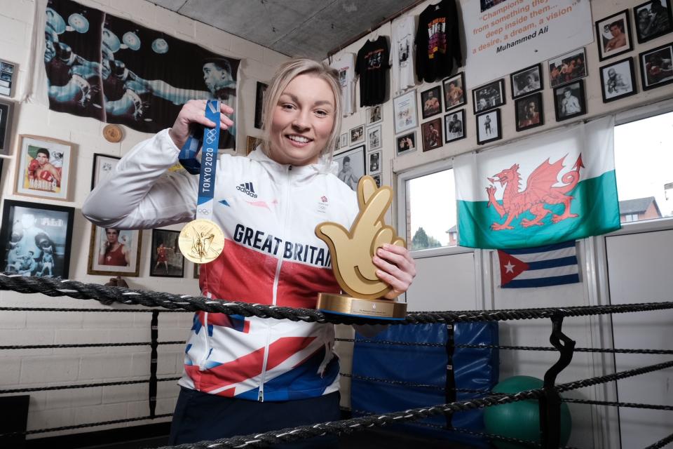 Lauren Price with her Olympic gold medal and National Lottery award for Olympian of the Year