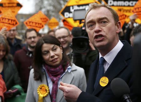Liberal Democrats winner of the Richmond Park by-election, Sarah Olney, celebrates her victory with party leader Tim Farron on Richmond Green in London, Britain December 2, 2016. REUTERS/Peter Nicholls