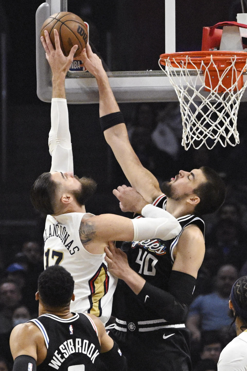 New Orleans Pelicans center Jonas Valanciunas, left, has his shot blocked by Los Angeles Clippers center Ivica Zubac during the first half of an NBA basketball game Saturday, March 25, 2023, in Los Angeles. (AP Photo/Mark J. Terrill)