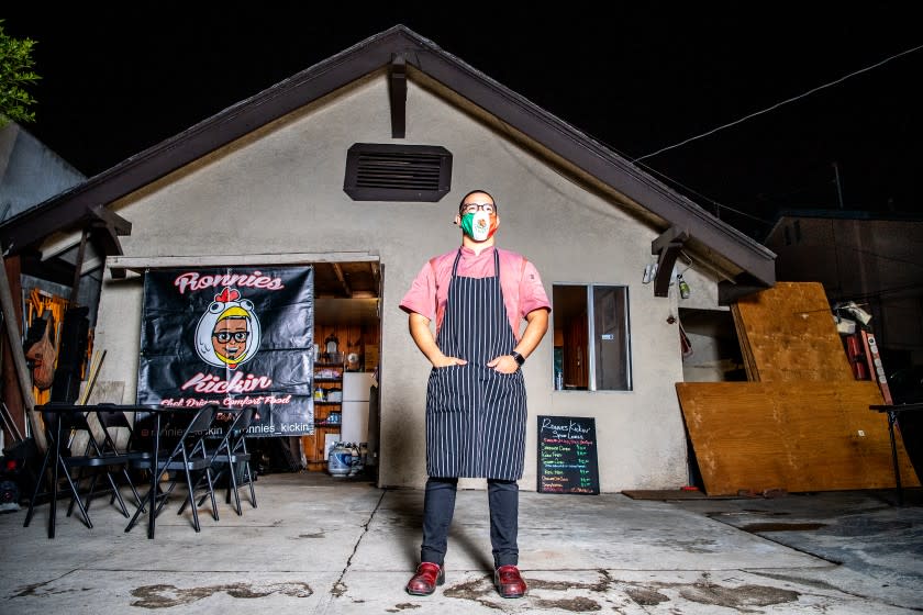 LOS ANGELES, CA - DECEMBER 03: Ronnie Munoz outside his restaurant, Ronnie's Kickin', in south Los Angeles on Thursday, Dec. 3, 2020 in Los Angeles, CA. Munoz converted a portion of his garage into a small kitchen, where fried chicken and an array of other menu items are available for pickup and delivery. (Mariah Tauger / Los Angeles Times)