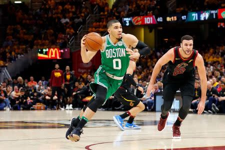 May 19, 2018; Cleveland, OH, USA; Boston Celtics forward Jayson Tatum (0) drives to the basket in front of Cleveland Cavaliers forward Larry Nance Jr. (22) during the second half in game three of the Eastern conference finals of the 2018 NBA Playoffs at Quicken Loans Arena. Mandatory Credit: Rick Osentoski-USA TODAY Sports