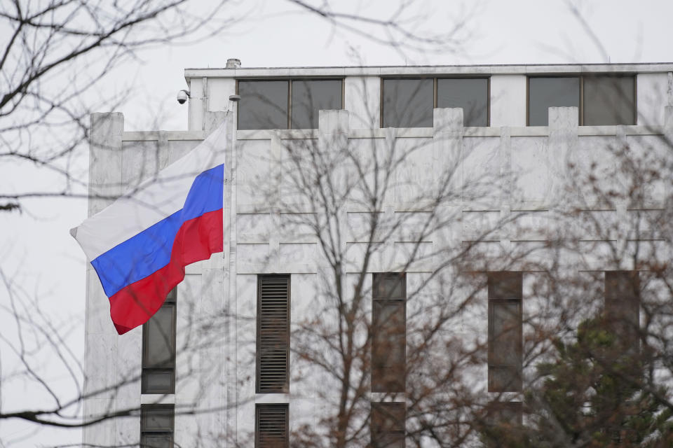 The Russian flag flies outside the Embassy of Russia in Washington, Thursday, Feb. 24, 2022. (AP Photo/Patrick Semansky)