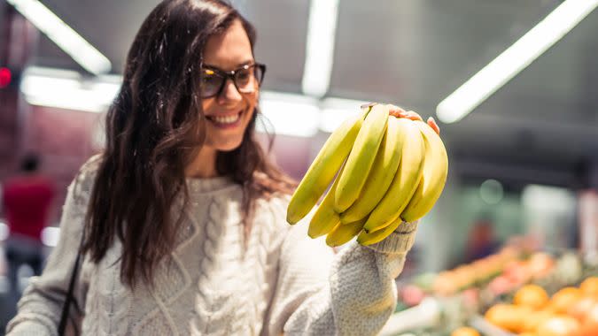 Woman shopping in the supermarket for some groceries.