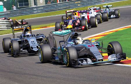 Mercedes Formula One driver Lewis Hamilton of Britain leads from pole position during the Belgian F1 Grand Prix in Spa-Francorchamps, Belgium August 23, 2015. REUTERS/Michael Kooren