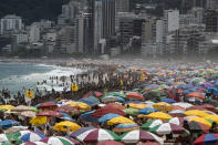 Despite restrictions to limit the spread of COVID-19, thousands crowd Ipanema Beach in Rio de Janeiro, Brazil, Sunday, Jan. 24, 2021. (AP Photo/Bruna Prado)