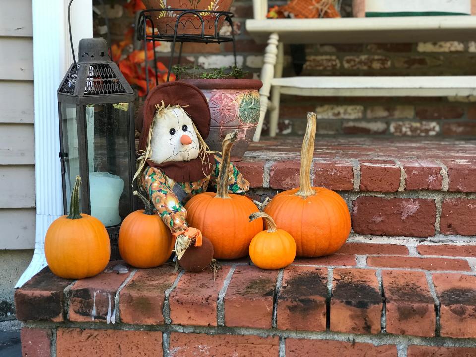 Pumpkins on a front porch halloween decor