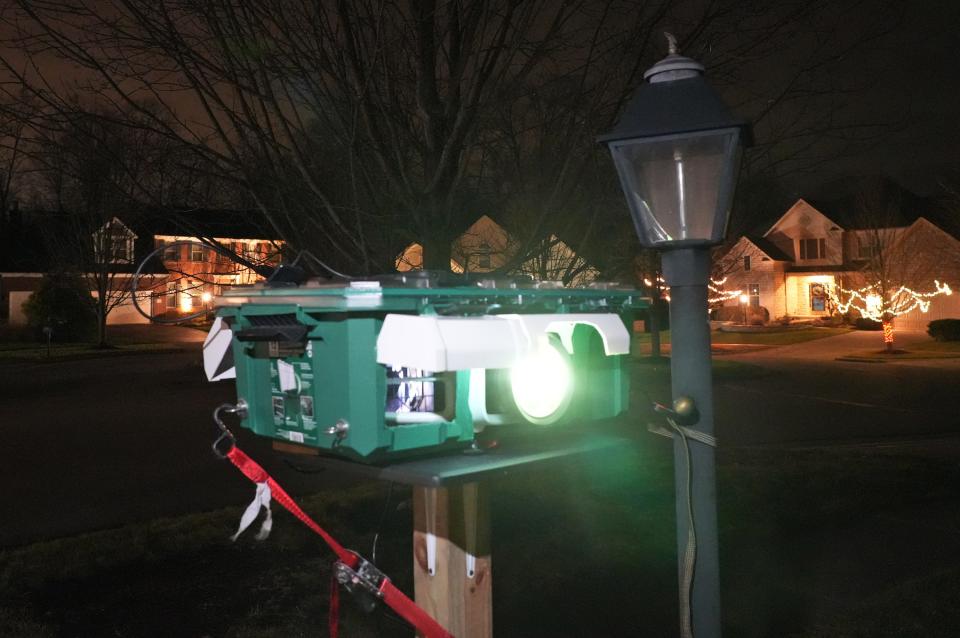 Powell homeowner Edgar Escobar used an old projector to create a Columbus Crew-themed home display that becamse popular after garnering attention on Reddit. He used spare gutter pieces to keep the mist and dew off the projector.