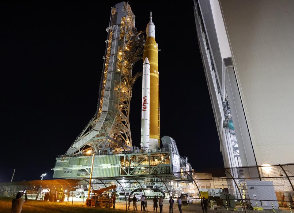 The NASA Artemis rocket with the Orion spacecraft aboard leaves the Vehicle Assembly Building moving slowly to pad 39B at the Kennedy Space Center in Cape Canaveral, Fla., Tuesday, Aug. 16, 2022. NASA is aiming for an Aug. 29 liftoff for the lunar test flight. (AP Photo/Terry Renna)