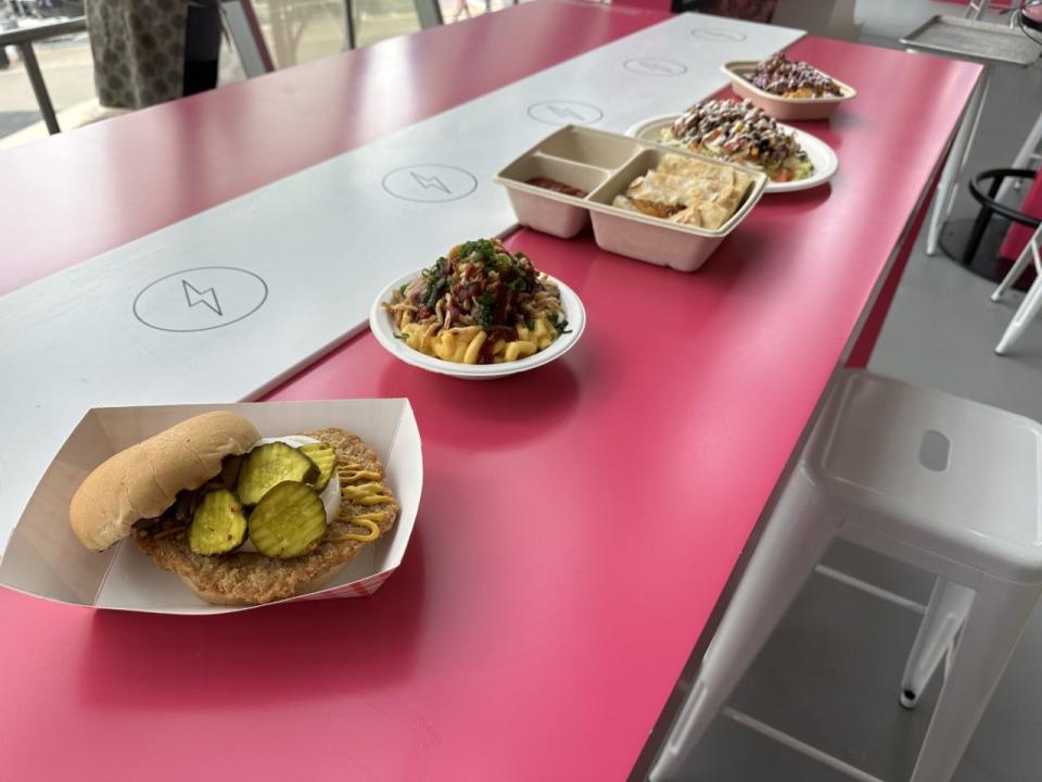 From left, Cyclones Tenderloin, Jayhawks Mac & Cheese, Longhorn Quesadilla, Stormin’ from Norman Oklahoma Taco and TCU Loaded Tots are pictured Friday, March 10, 2023, for the Big 12 Tournament at T-Mobile Center in Kansas City, Missouri.