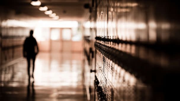 PHOTO: A high school student walks down a dark hallway in a public high school in this undated stock photo. (STOCK PHOTO/Getty Images)
