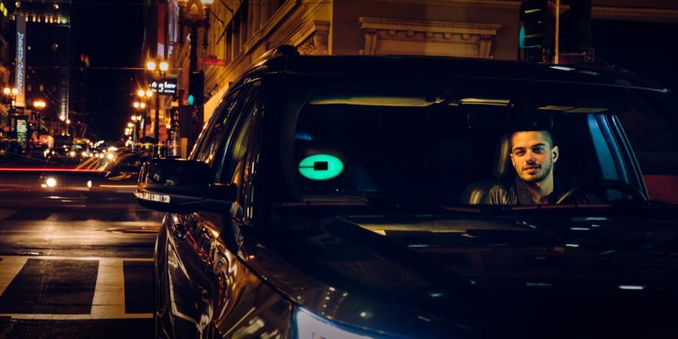 AN Uber driver with the Uber beacon.