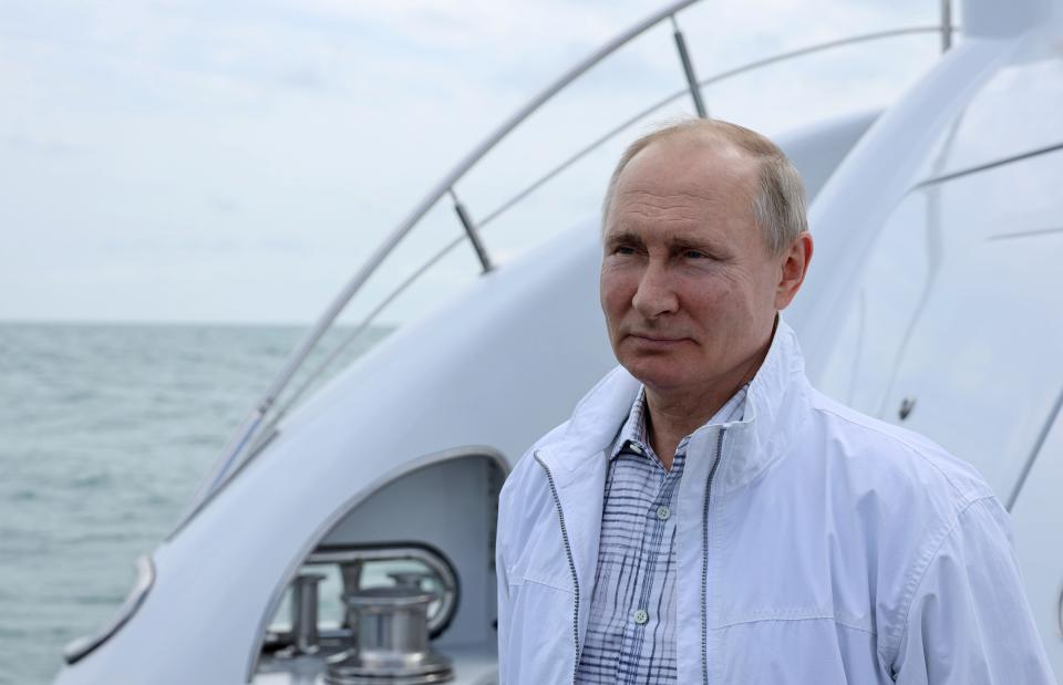 Russian President Vladimir Putin waits to meet Belarusian President Alexander Lukashenko on the boat prior to their meeting in the Black Sea resort of Sochi, in Russia, Saturday, May 29, 2021. (Sergei Ilyin, Sputnik, Kremlin Pool Photo via AP)