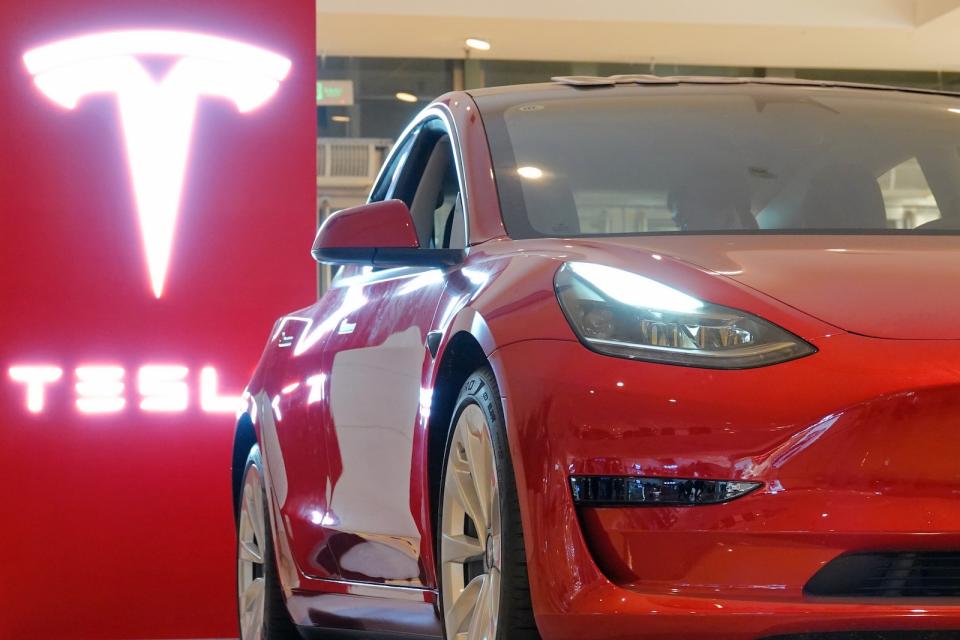 YANTAI, CHINA - OCTOBER 17, 2021 - A Tesla Model 3 is displayed at the Tesla Experience store in Joy City, Yantai, East China's Shandong Province, Oct 17, 2021. In September 2021, Tesla China set a new record of 56,006 vehicles. (Photo credit should read Tang Ke / Costfoto/Barcroft Media via Getty Images)