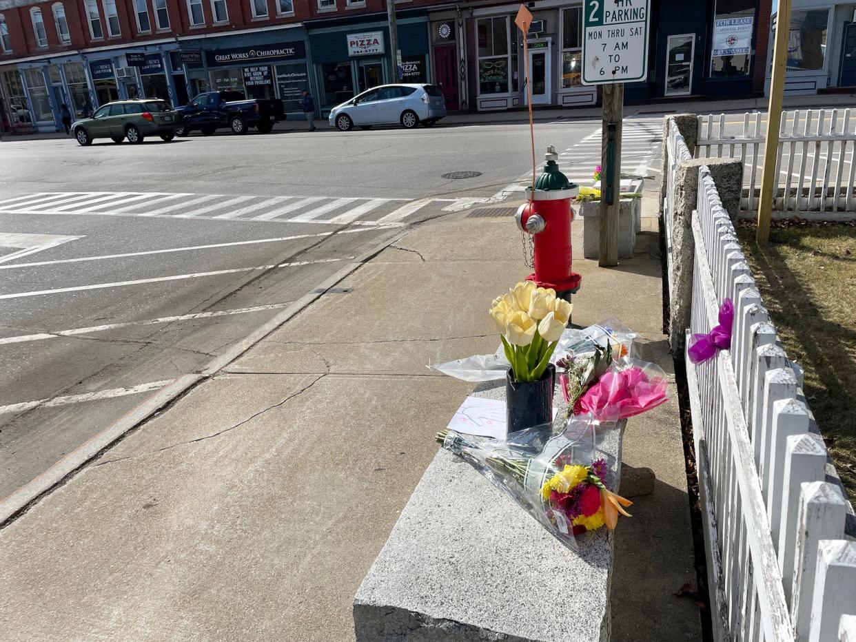 South Berwick resident John Nason died from a medical emergency while sitting on his favorite bench in the center of town Wednesday, March 13, 2024. The following day, flowers and notes are seen left in his memory.