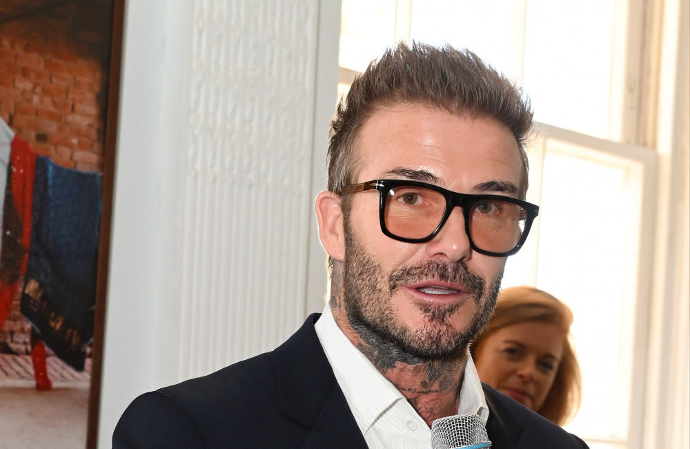 David Beckham looked dashing in a pair of tinted specs credit:Bang Showbiz