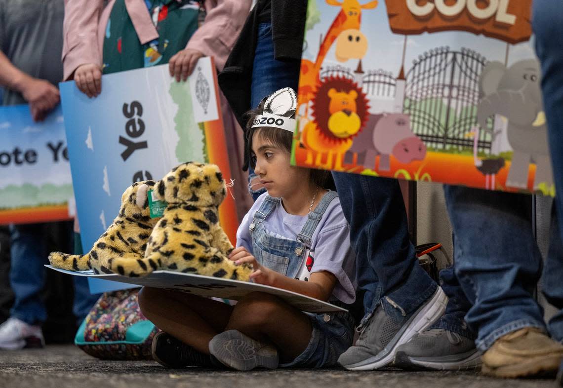 Ivanna Velez, age 10, of Rancho Cordova plays with stuffed animals on Wednesday, May 8, 2024, as the Elk Grove City Council listens to plans to relocate the Sacramento Zoo to Elk Grove.