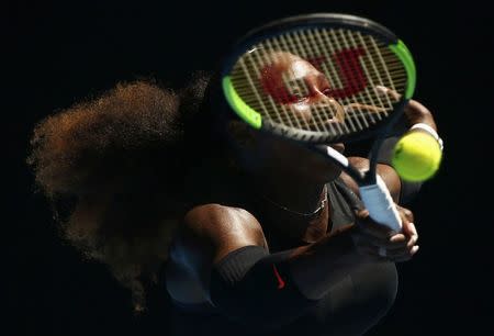 Tennis - Australian Open - Melbourne Park, Melbourne, Australia - 25/1/17 Serena Williams of the U.S. hits a shot during her Women's singles quarter-final match against Britain's Johanna Konta. REUTERS/Thomas Peter