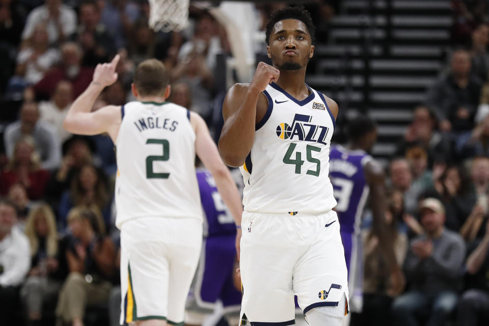 Utah Jazz guard Donovan Mitchell (45) reacts after a basket and a foul for teammate center Rudy Gobert (27) in the second quarter against the Sacramento Kings at Vivint Smart Home Arena. Mandatory Credit: Jeff Swinger-USA TODAY Sports