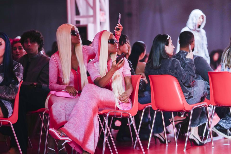 People attend the Diesel women's Fall-Winter 2023-24 collection show presented in Milan, Italy, Wednesday, Feb. 22, 2023. (AP Photo/Luca Bruno)