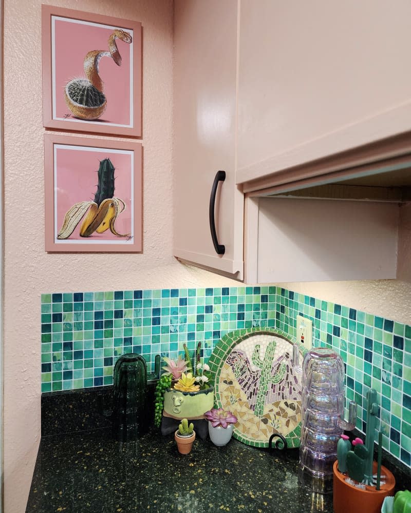 Green tile in pink painted kitchen.
