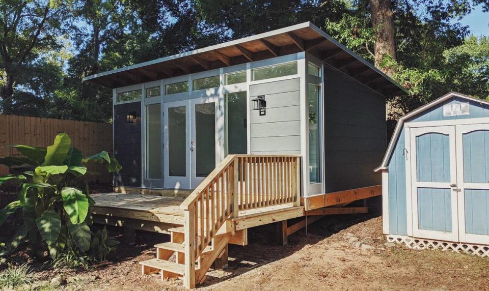 The Morgan family was able to avoid moving by installing a shed as an office, creating extra space in their home for their newborn twins.