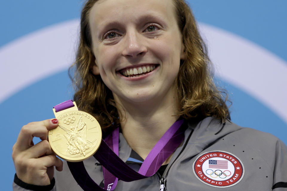 FILE - United States' Katie Ledecky poses on the podium with her gold medal in the women's 800-meter freestyle swimming final at the Aquatics Centre in the Olympic Park during the 2012 Summer Olympics in London, Aug. 3, 2012. Ledecky started off the U.S. national championships Tuesday, June 27, 2023, with a dazzling performance in the 800-meter freestyle. She turned in her fastest time since setting the world record at the 2016 Rio Olympics. At 26, Ledecky has already sealed her legacy as one of the greatest freestyle swimmers the sport has ever witnessed, yet she shows no signs of slowing down. (AP Photo/Michael Sohn, File)