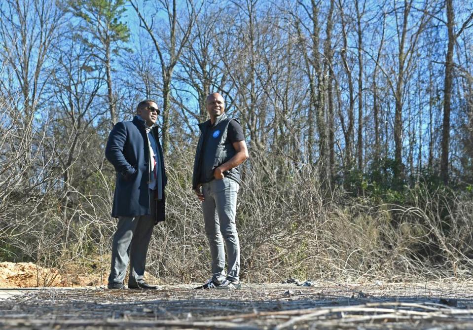 William Haygood, left, and Rodney Faulkner, are working to bring a grocery store as well as apartments to this vacant, undeveloped site along Statesville Avenue.