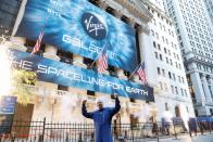 Sir Richard Branson stands outside the New York Stock Exchange (NYSE) ahead of Virgin Galactic's IPO in New York