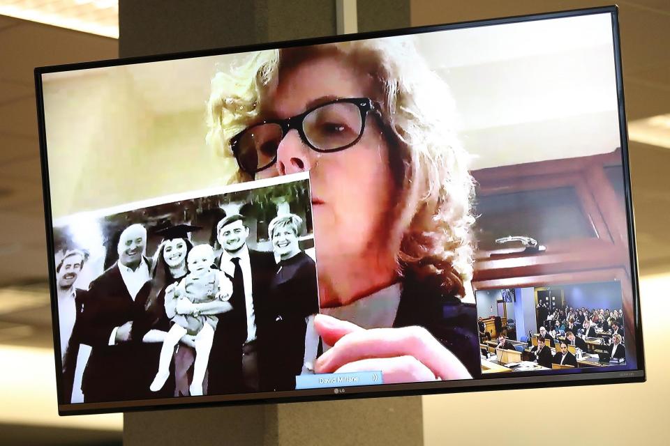 Gillian Millane holds a family photograph during her televised victim impact statement from her home in the UK (Getty Images)