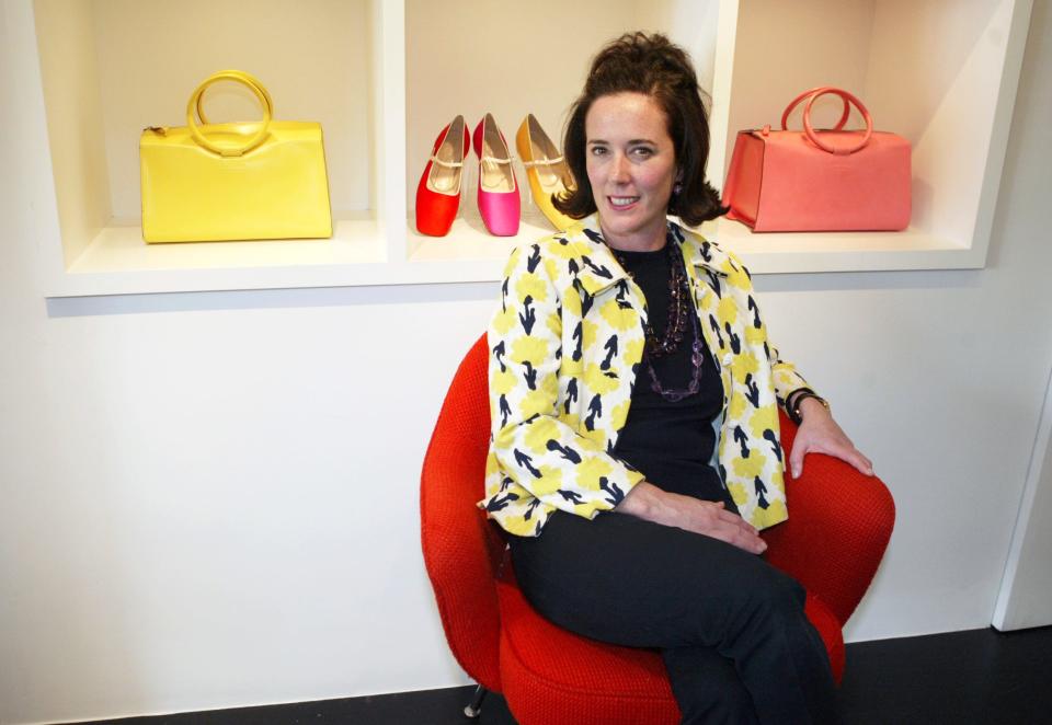 This May 13, 2004 photo shows designer Kate Spade posing among handbags and shoes from her collection in New York. 