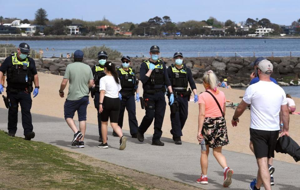 Police patrol Elwood Beach during an anti-lockdown protest in Melbourne on Saturday. Source: Getty