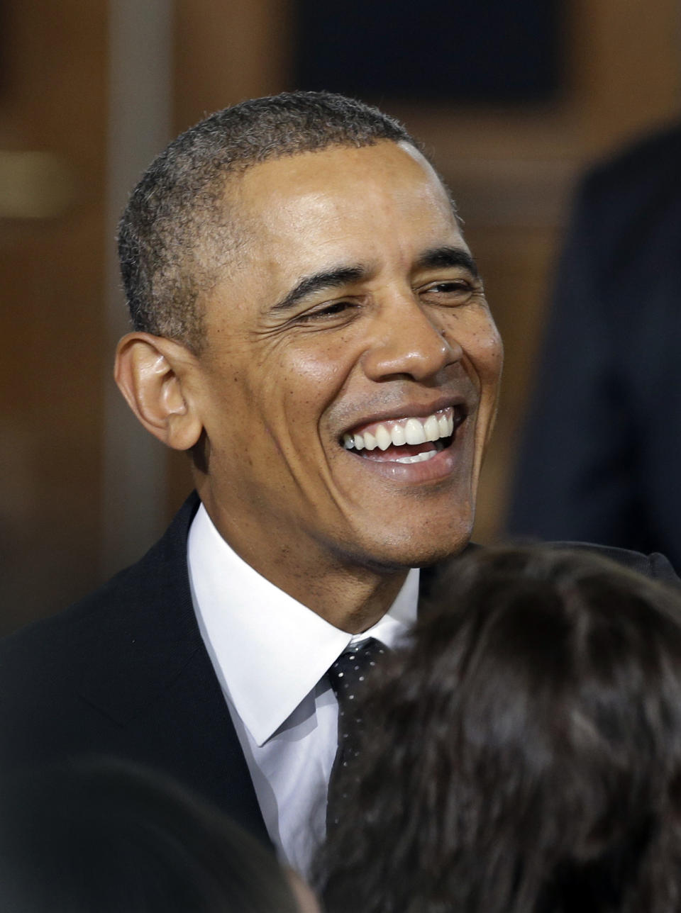 President Barack Obama greets people Wednesday, Feb. 26, 2014 at the Union Depot in St. Paul, Minn. President Barack Obama said Wednesday he will ask Congress for $300 billion to update aging roads and railways, arguing that the taxpayer investment is a worthy one that will pay dividends by attracting businesses and helping put people to work. (AP Photo/Jim Mone)