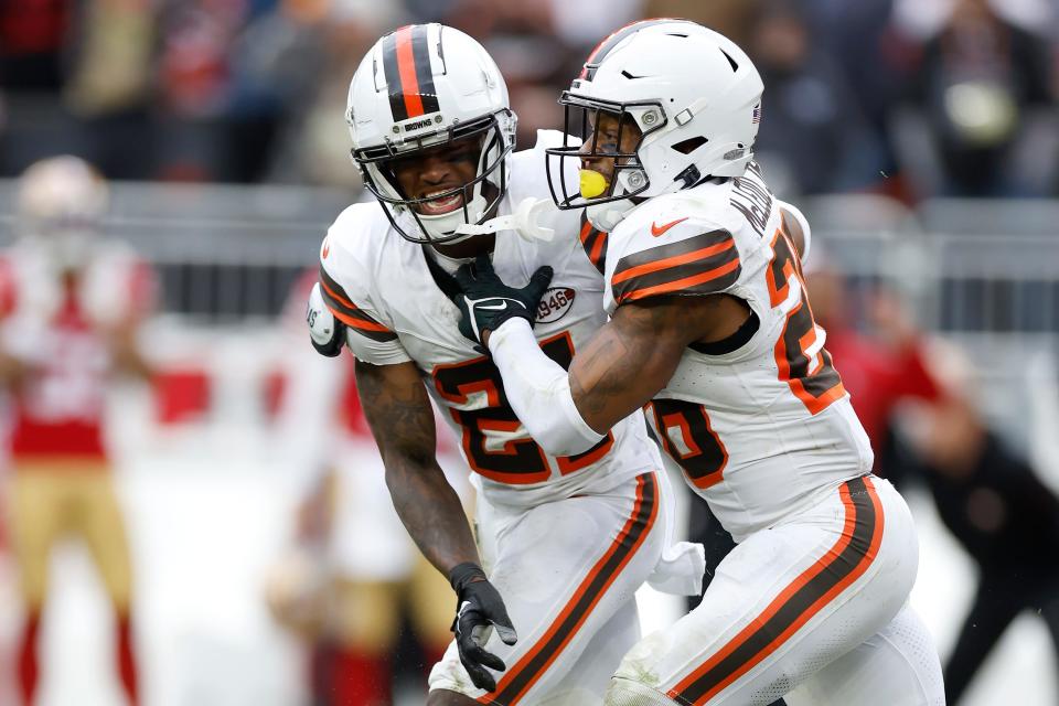 Browns defensive players Denzel Ward, left, and Rodney McLeod Jr. celebrate after San Francisco 49ers kicker Jake Moody missed a field goal on Oct. 15 in Cleveland.