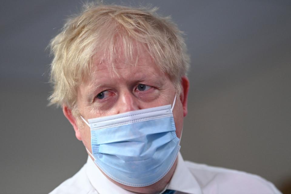 Britain&#39;s Prime Minister Boris Johnson visits Colchester hospital in Colchester, eastern England on May 27, 2021. - Britain&#39;s government 