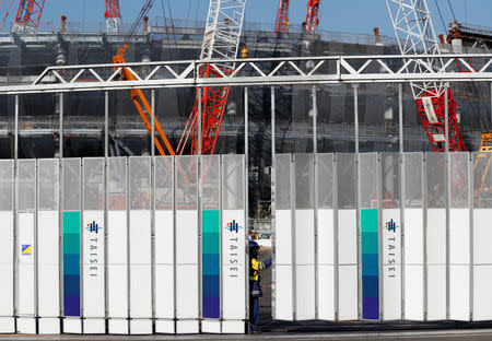 Logos of Japanese construction company Taisei Corporation are seen at a gate of the construction site of New National Stadium for the Tokyo 2020 Olympics and Paralympics in Tokyo, Japan December 22, 2017. REUTERS/Issei Kato