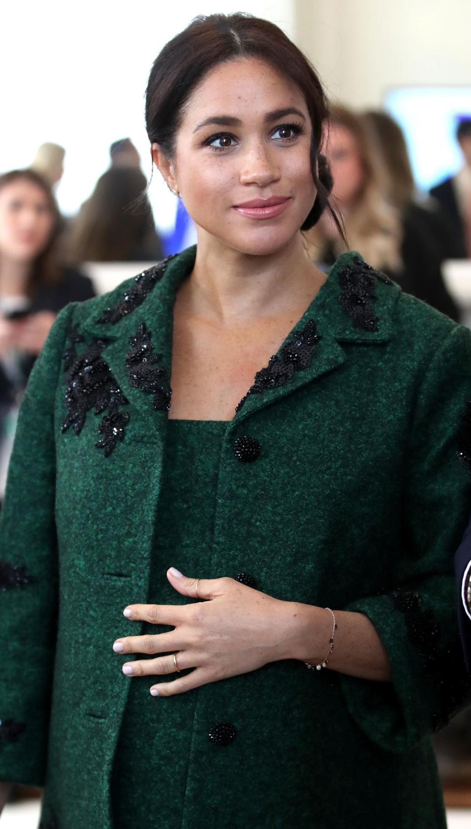 Meghan wearing a green Erdem coat at Canada House yesterday [Photo: Getty]