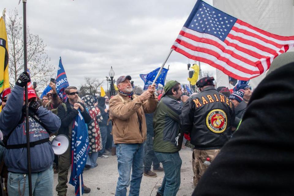 Trump supporters gather on the steps of the Capitol building after the Stop the Steal rally.