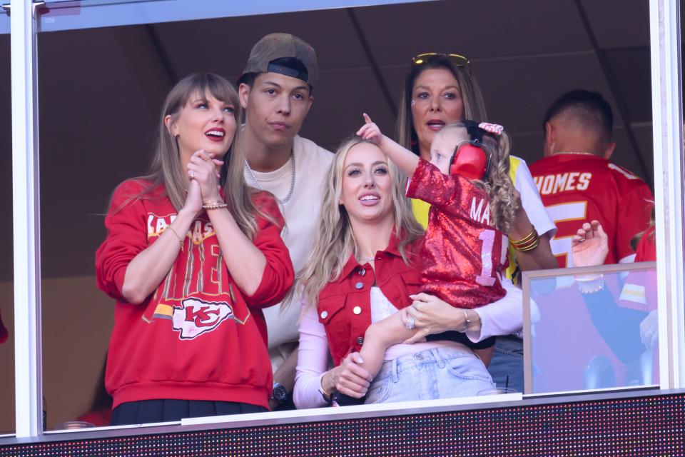 Taylor Swift, left, and Brittany Mahomes, right, watch an NFL football game between the Kansas City Chiefs and the Los Angeles Chargers with Jackson Mahomes, back left and Randi Mahomes, back right (Patrick Mahomes mother), Sunday, Oct. 22, 2023 in Kansas City, Mo. | Reed Hoffmann, Associated Press