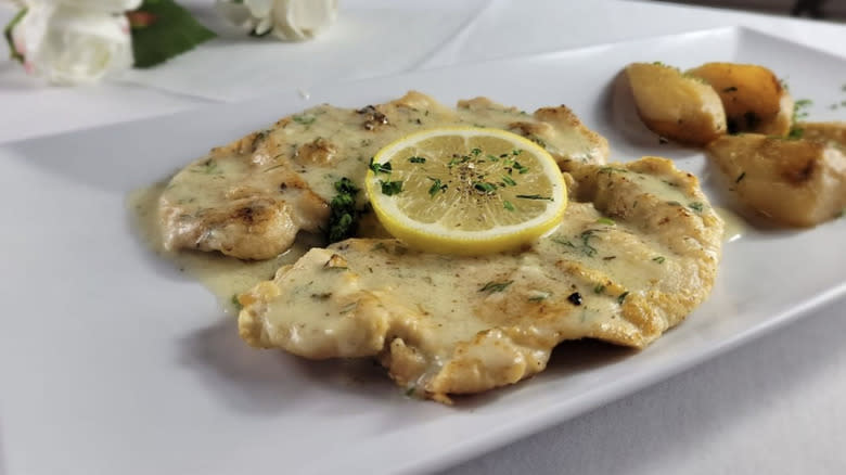 Cutlet with lemon on plate