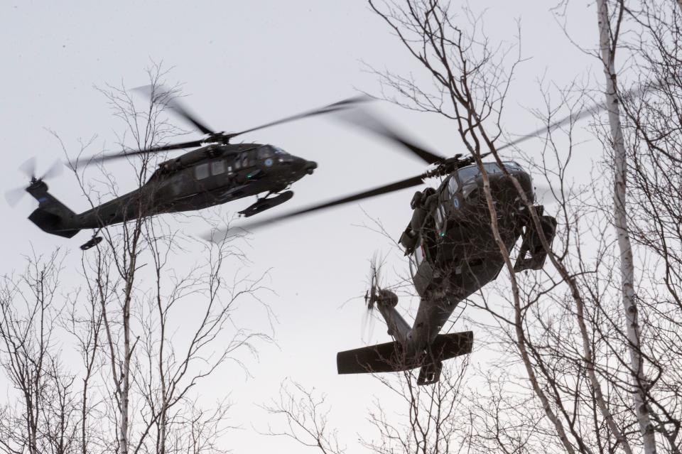 Two Alaska Army National Guard UH-60 Black Hawk helicopters from the 1st Battalion, 207th Aviation Regiment, approach a mock evacuation site while participating in a mass-casualty training event at Joint Base Elmendorf-Richardson, Alaska, Nov. 21, 2017.